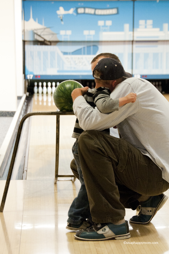 boyhuggingfatherafterbowling