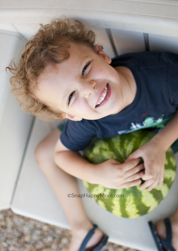 boy holding watermelon