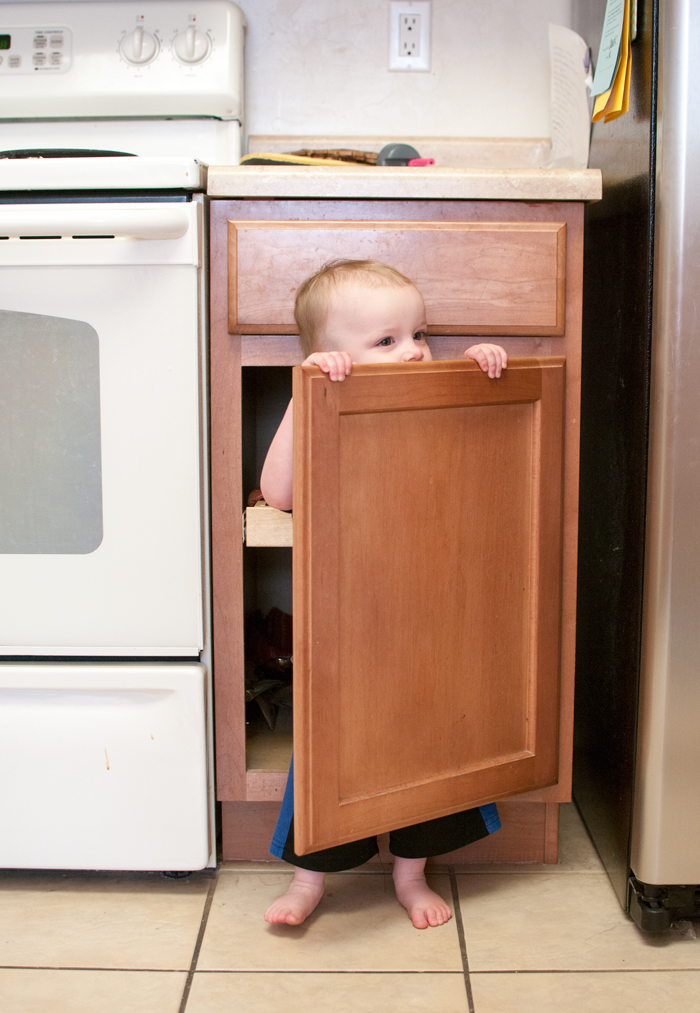 Hiding in cupboards is fun! - SnapHappyMom.com