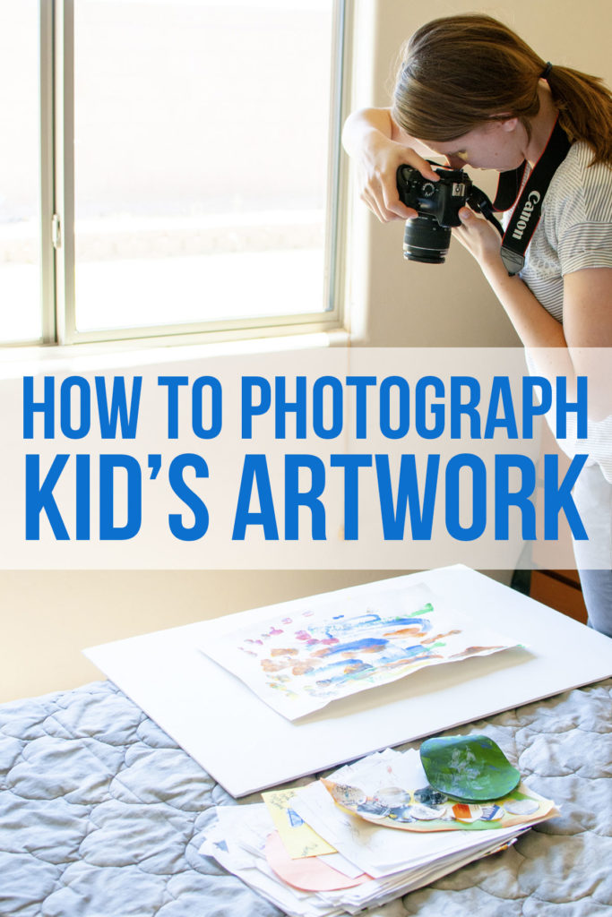 woman photographing children's artwork